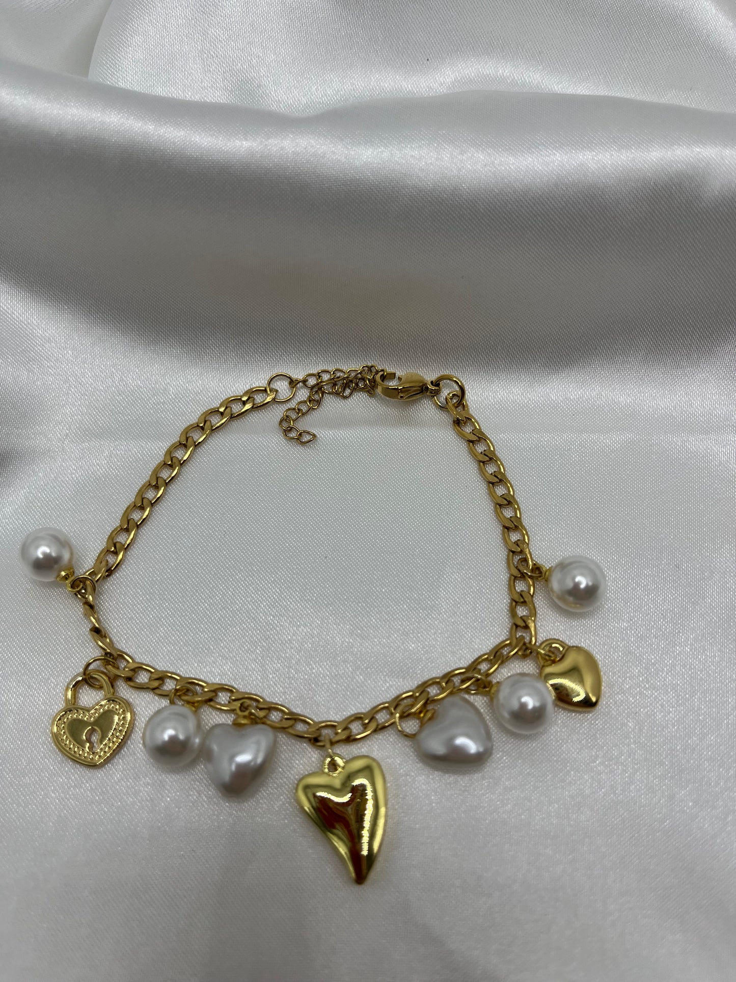 Heartfelt gold and white charm bracelet